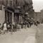 Depression era street life with children playing and dancing in the street. Lots of vintage storefronts and two 1920 cars parked. 28th street looking east from Second Avenue. New York. April 1931. | Flickr - Photo Sharing!