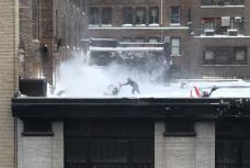snow blowing on the roof